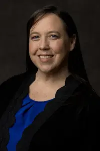 Brittney Sweeney Headshot on dark gray background