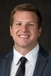 Hendrix Brakefield Headshot on dark background