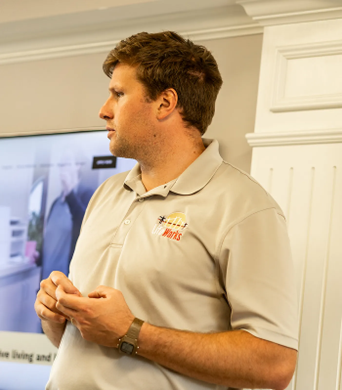 LifeWorks Director is addressing participants in the main office common area.